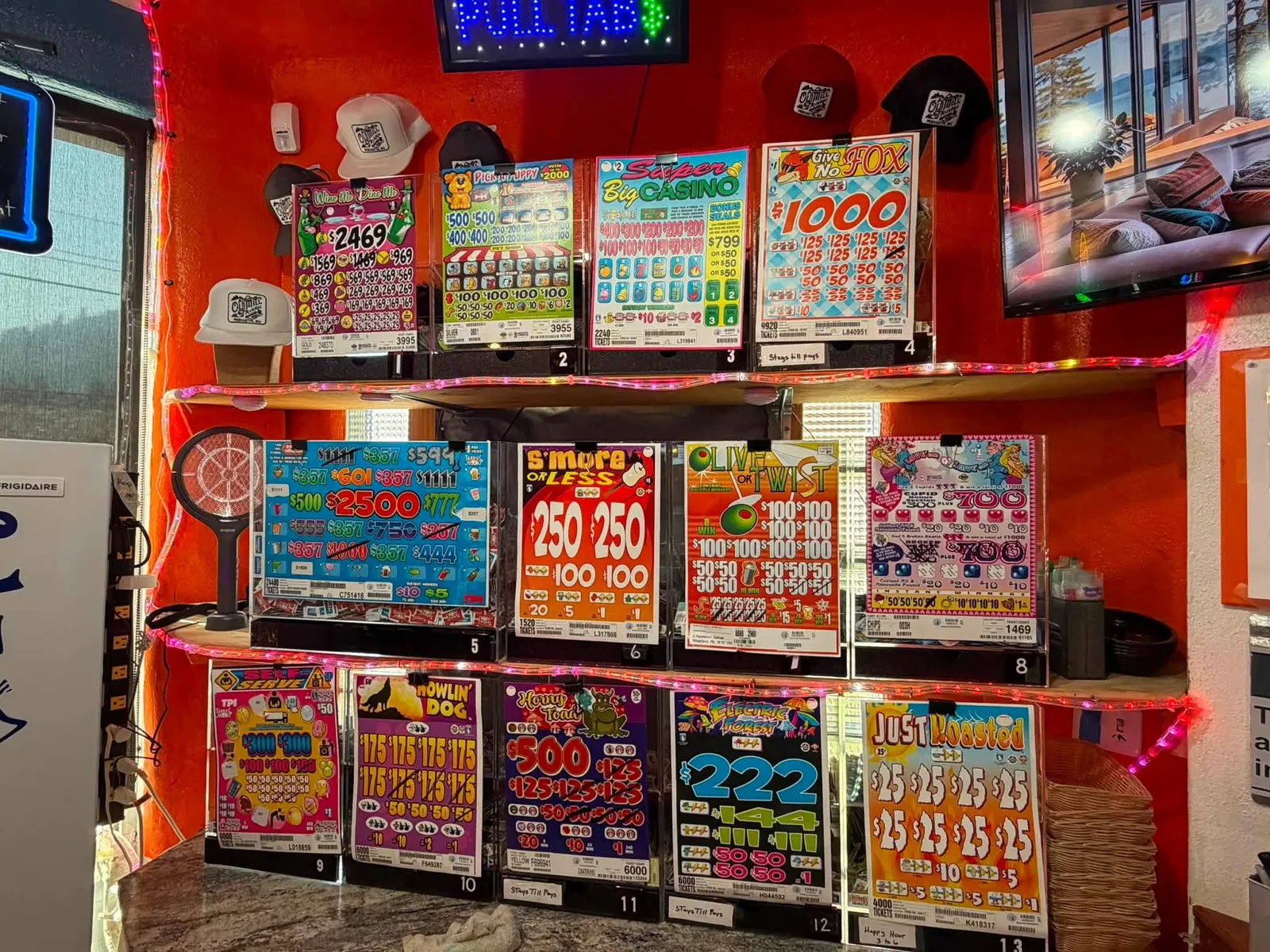 Wall of pull tab games at Old Mill Tavern in Peshastin, WA