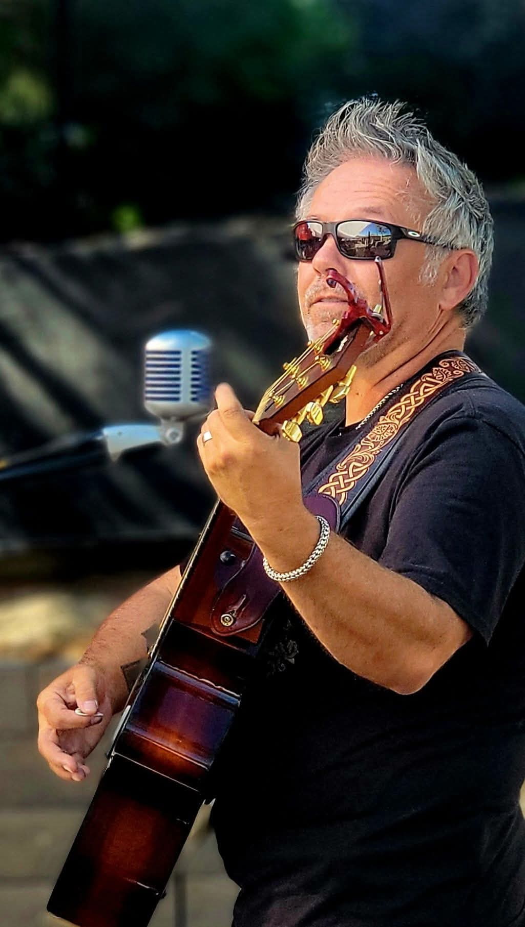 Taste of Whisky performer with acoustic guitar at Old Mill Tavern in Peshastin, WA