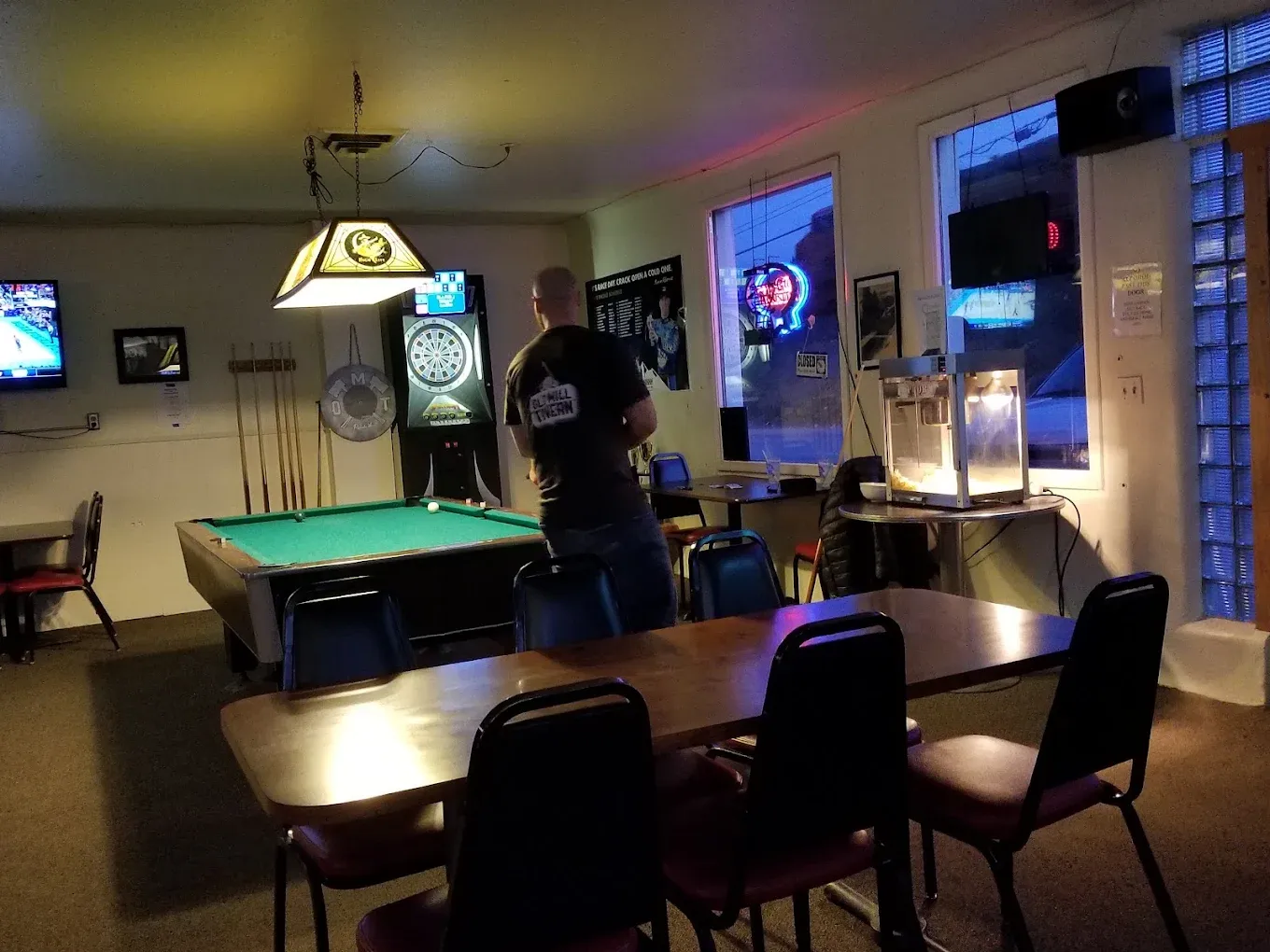 Green felt pool table under a hanging lamp at Old Mill Tavern in Peshastin, WA