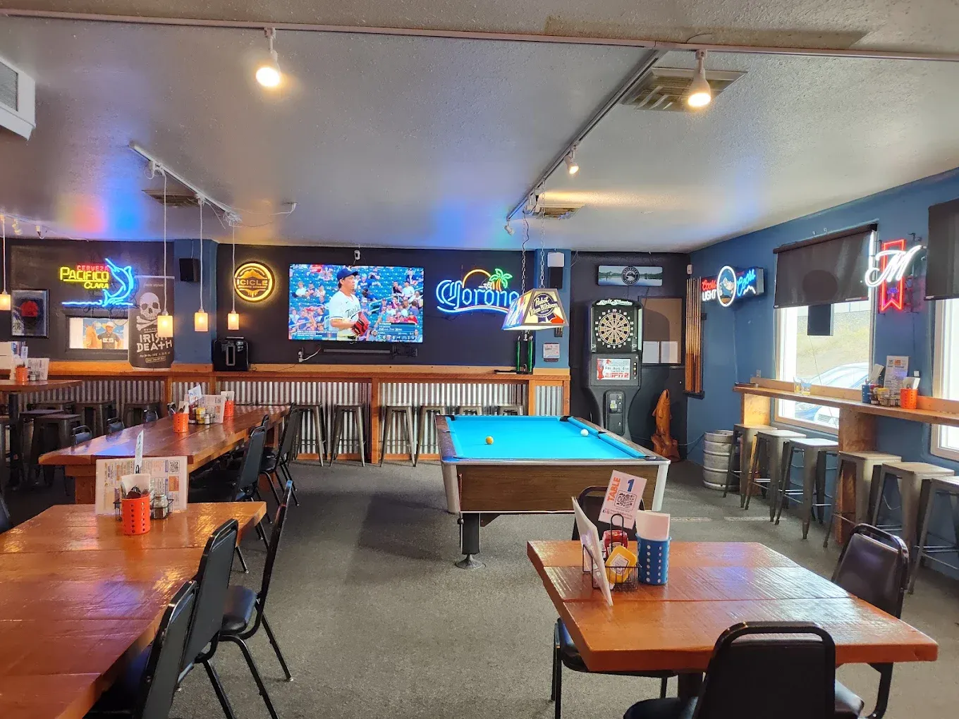 Wide interior view with the pool table and dartboard at Old Mill Tavern in Peshastin, WA