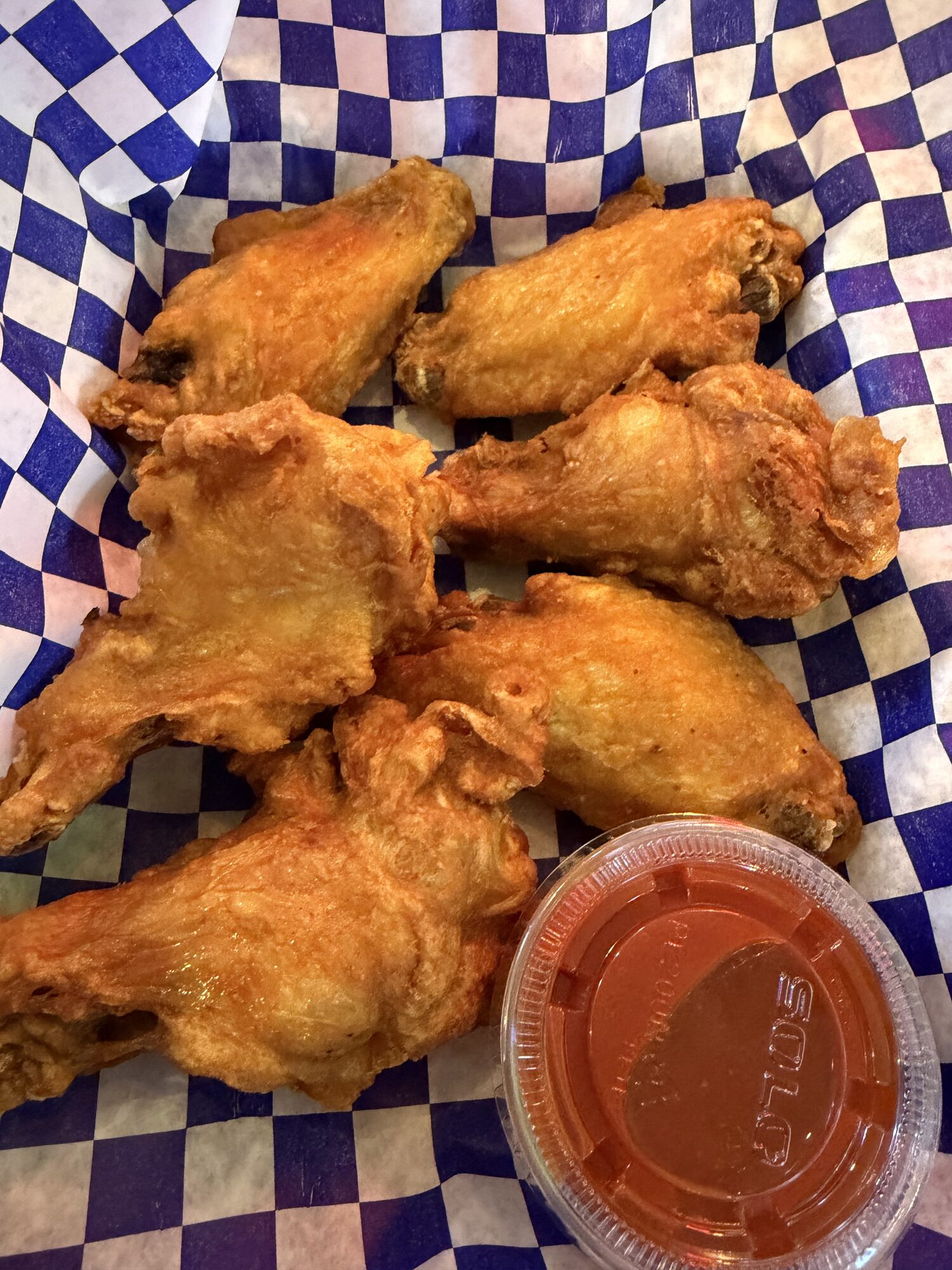 Basket of saucy chicken wings at Old Mill Tavern in Peshastin, WA