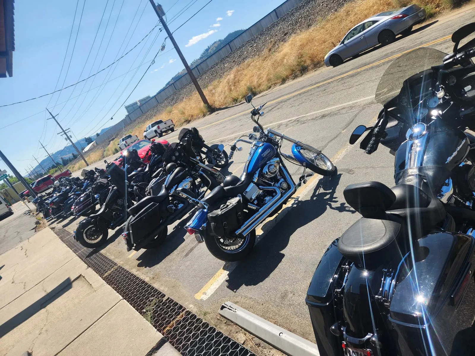 Row of motorcycles parked along the highway outside Old Mill Tavern in Peshastin, WA
