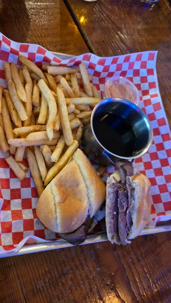 French dip sandwich with fries and au jus at Old Mill Tavern in Peshastin, WA