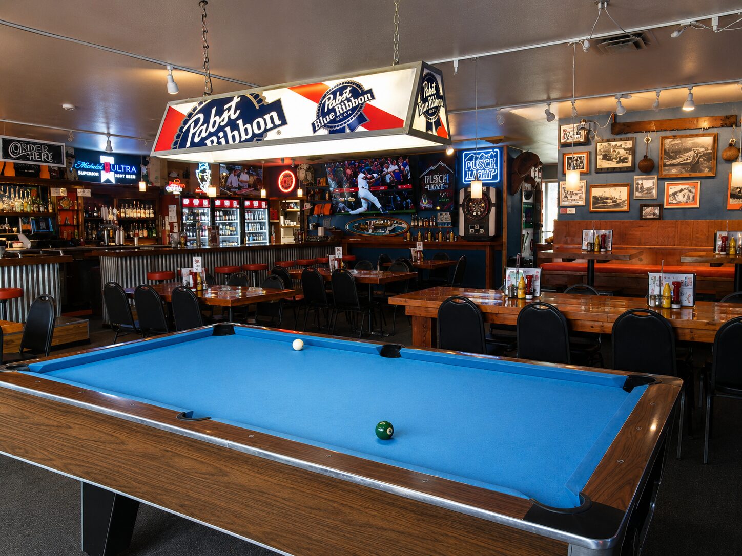 Pool table under a Pabst Blue Ribbon hanging light at Old Mill Tavern in Peshastin, WA