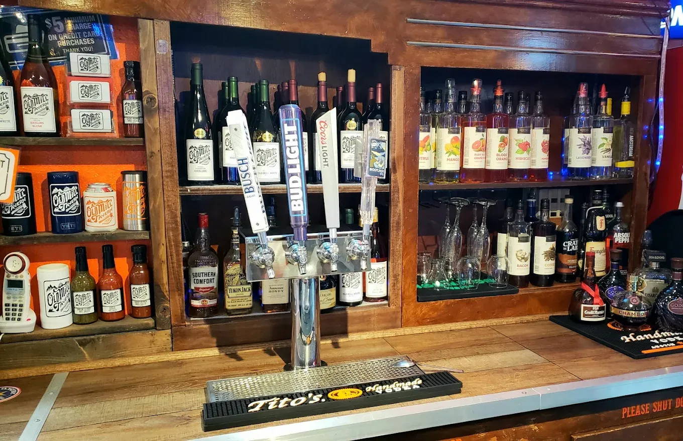 Back bar with liquor bottles and beer taps at Old Mill Tavern in Peshastin, WA
