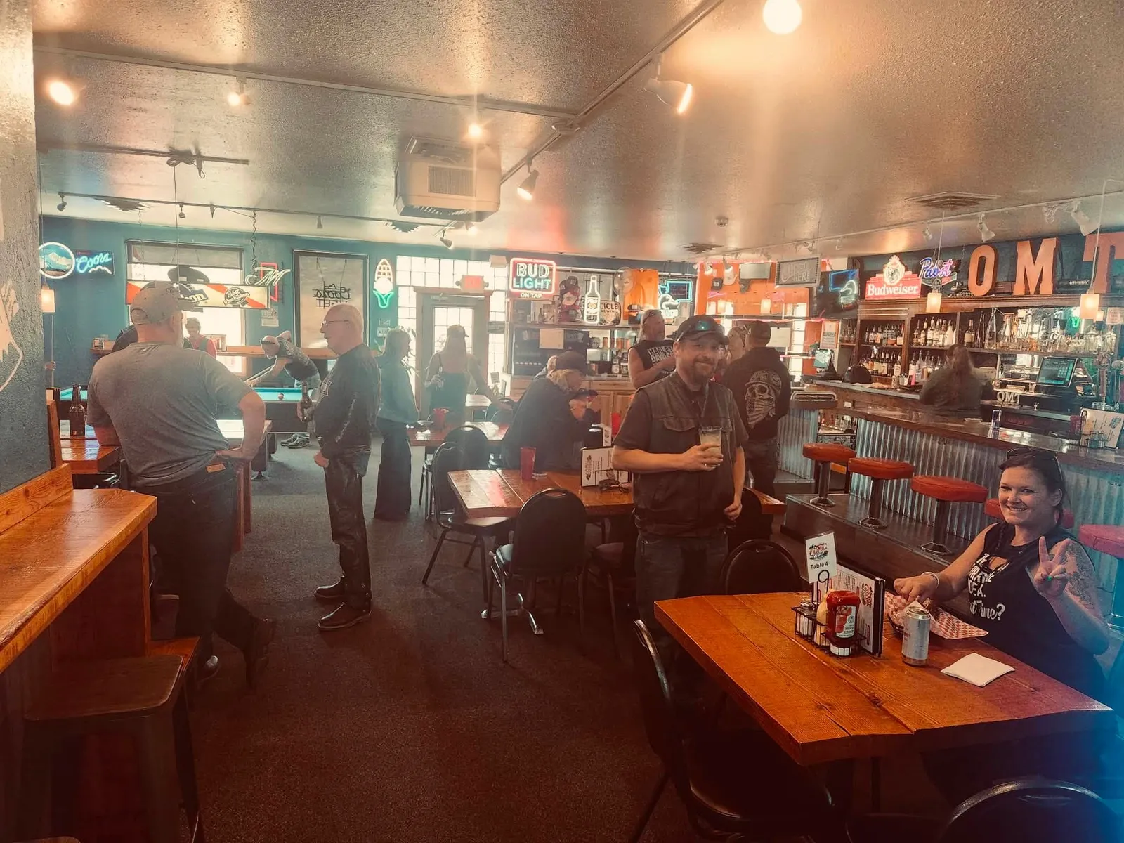Warm evening crowd filling the tables inside Old Mill Tavern in Peshastin, WA