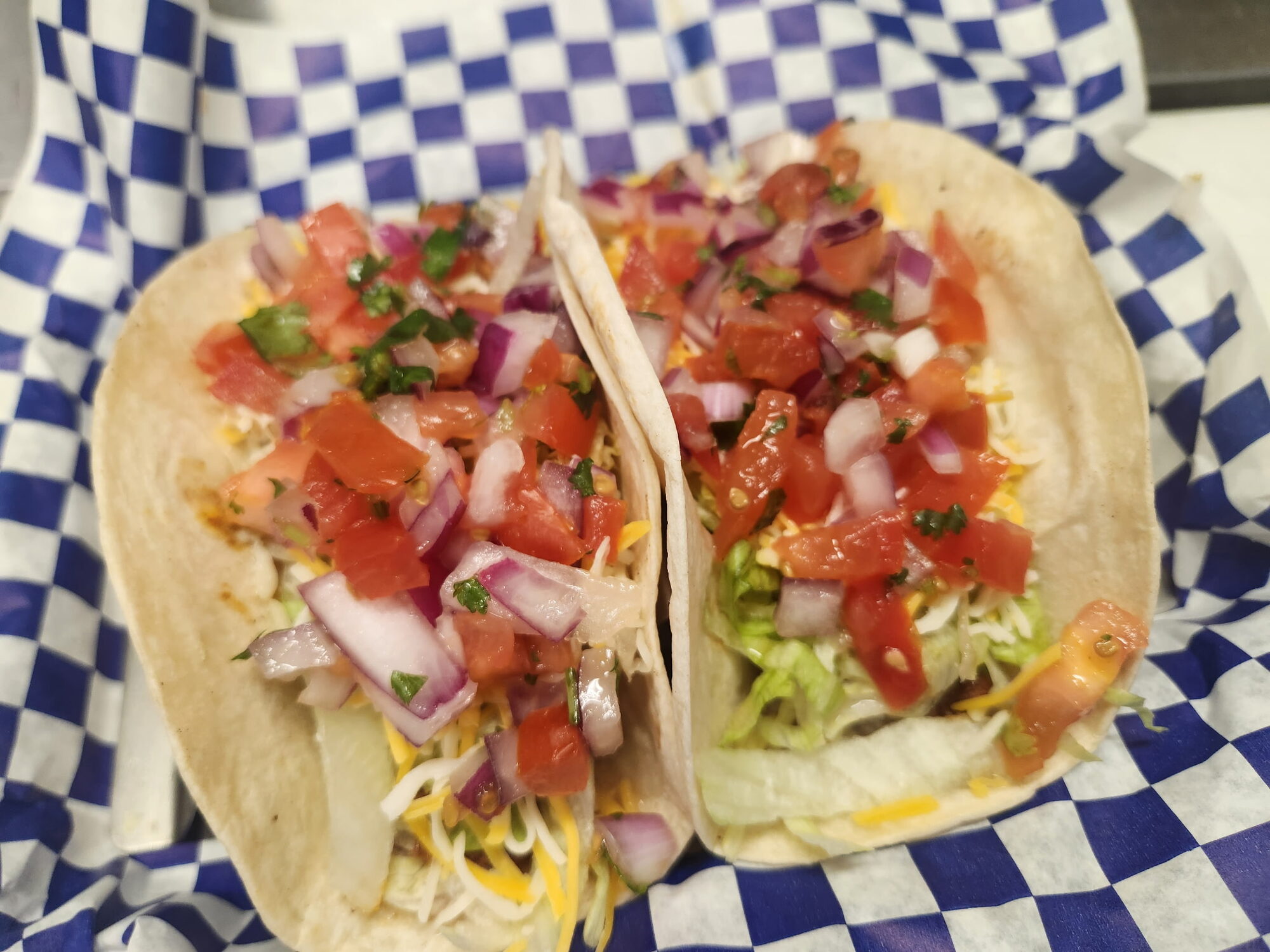 Close-up of tacos topped with fresh pico de gallo at Old Mill Tavern in Peshastin, WA